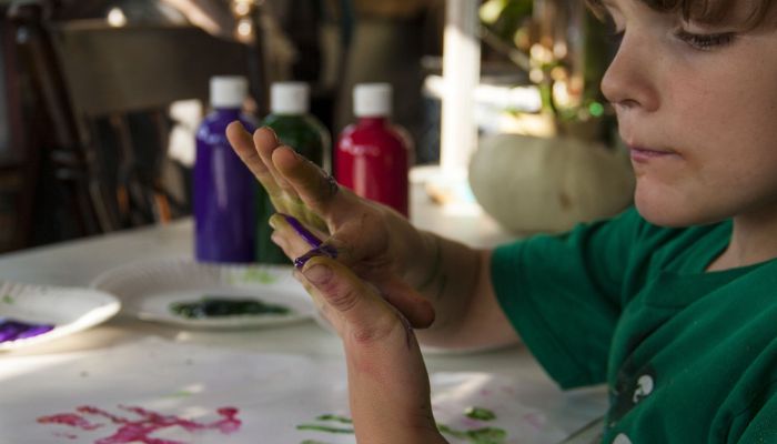 boy finger painting