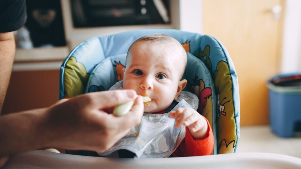 newborn wearing bib